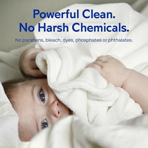 Baby wrapped in blanket with text about no harsh chemicals.