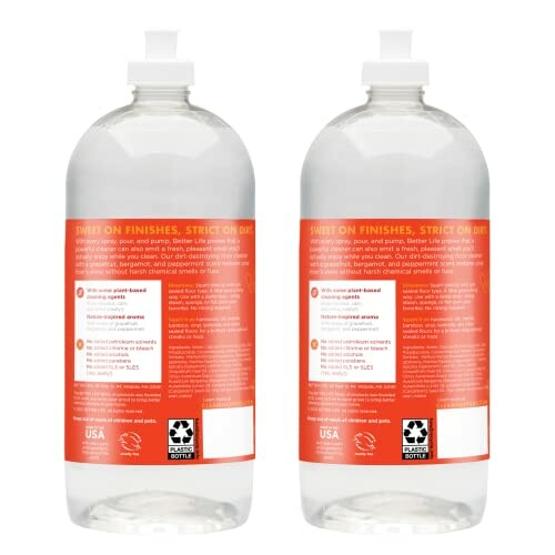 Two bottles of clear liquid soap with red labels.