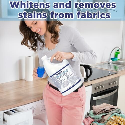 Woman using laundry stain remover by washing machine.