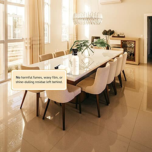 Elegant dining room with a long table and chairs, featuring a cleaning product on the table.