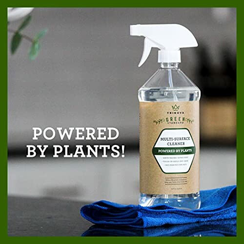 Plant-based multi-surface cleaner spray bottle with blue cloth.