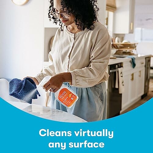 Woman using ECOS cleaner in kitchen